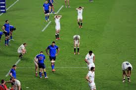 England players stand disconsolate at the final whistle